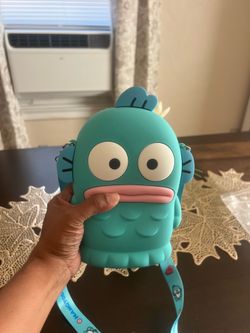 Cute Hangyodon cross body bag. Bag is silicone material. Adjustable strap has Hangyodon characters.