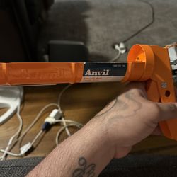 Anvil Smooth Rod Caulk Gun Orange 10 OZ