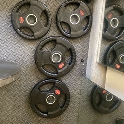 Two 5kg and two 7.5kg Olympic plates