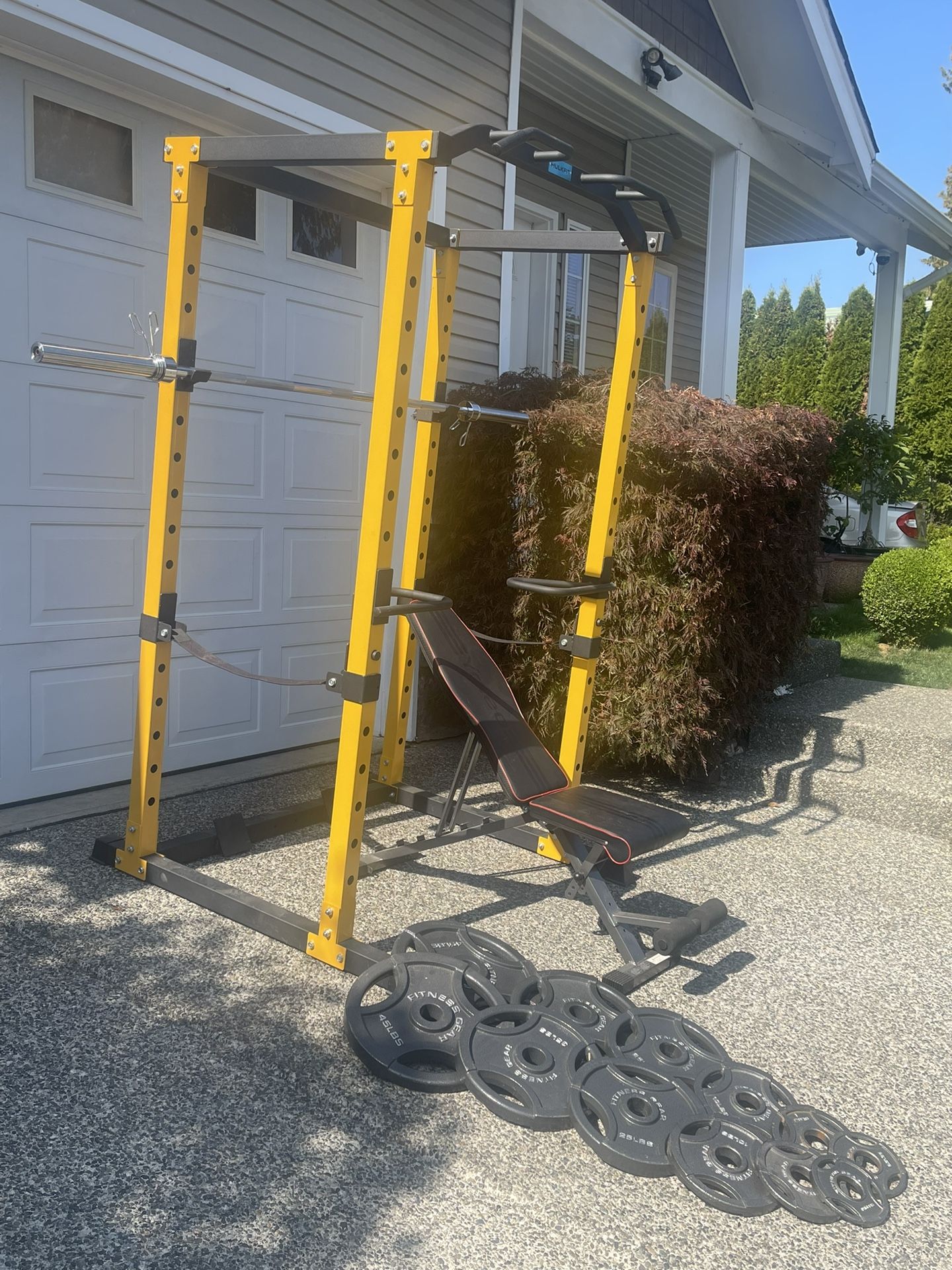 Squat rack,bench,barbell and weights