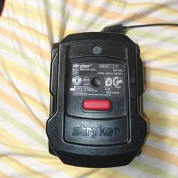Stryker battery charger with power adapter.