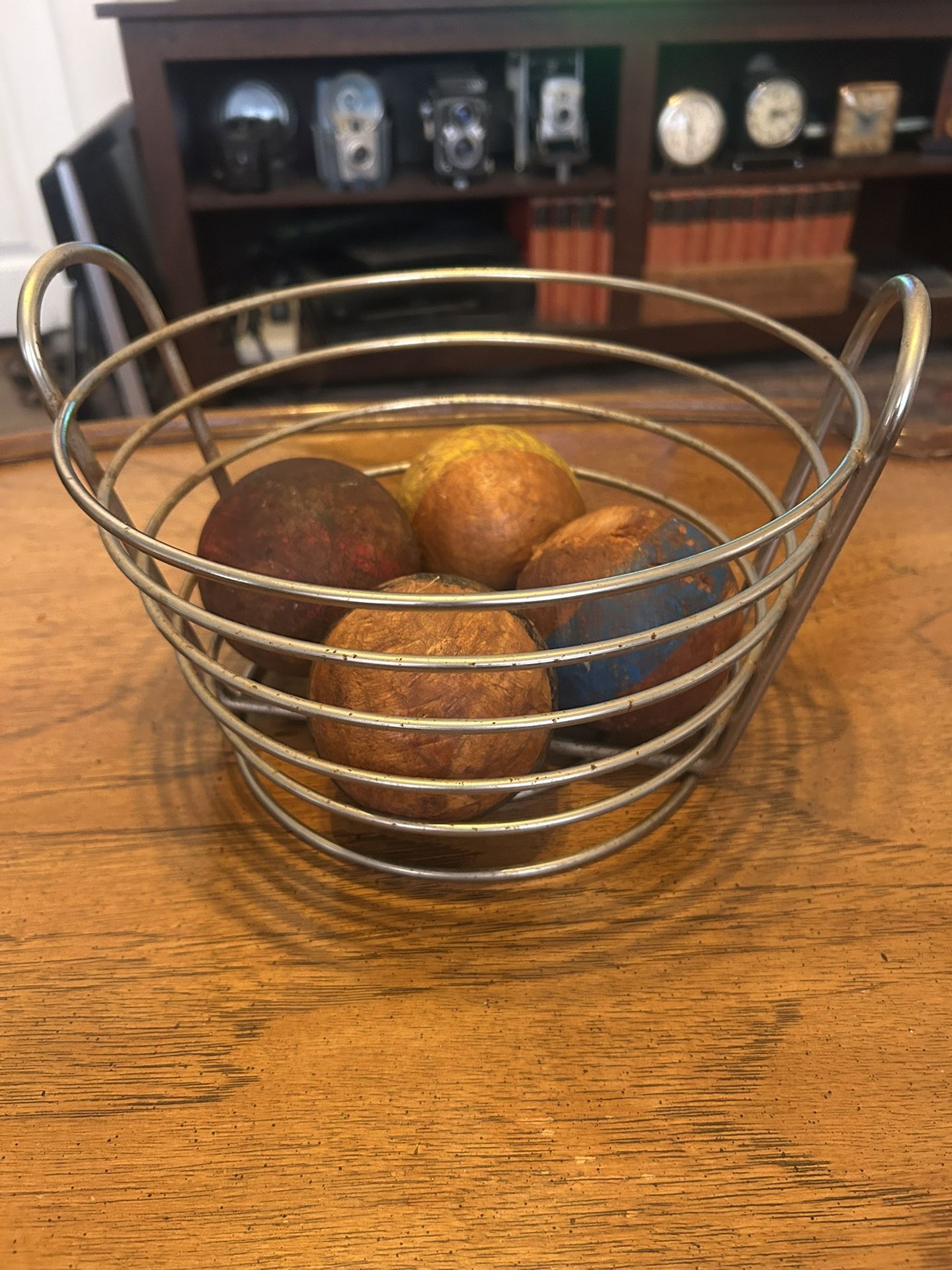 This takes balls; Set of Four Vintage 1930s Wood Croquet Balls in a Chrome 80s Basket: