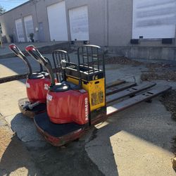 2 × Raymond 8410 Electric Pallet Jacks + Ametek LTD Charger – 6,000 lb Each