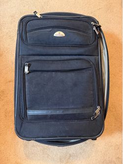 SUITCASE. 14 1/2"w x 12"d x 22"tall; cross streets are Arapaho & Waterview15