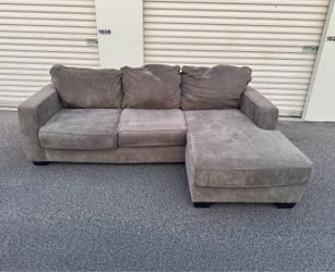 Gray Ashleys Furniture Sectional with Reversible Chaise(WILL DELIVER)