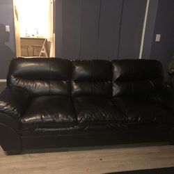 Black Sofa - Has A Small Tear In The Middle Of A Cushion