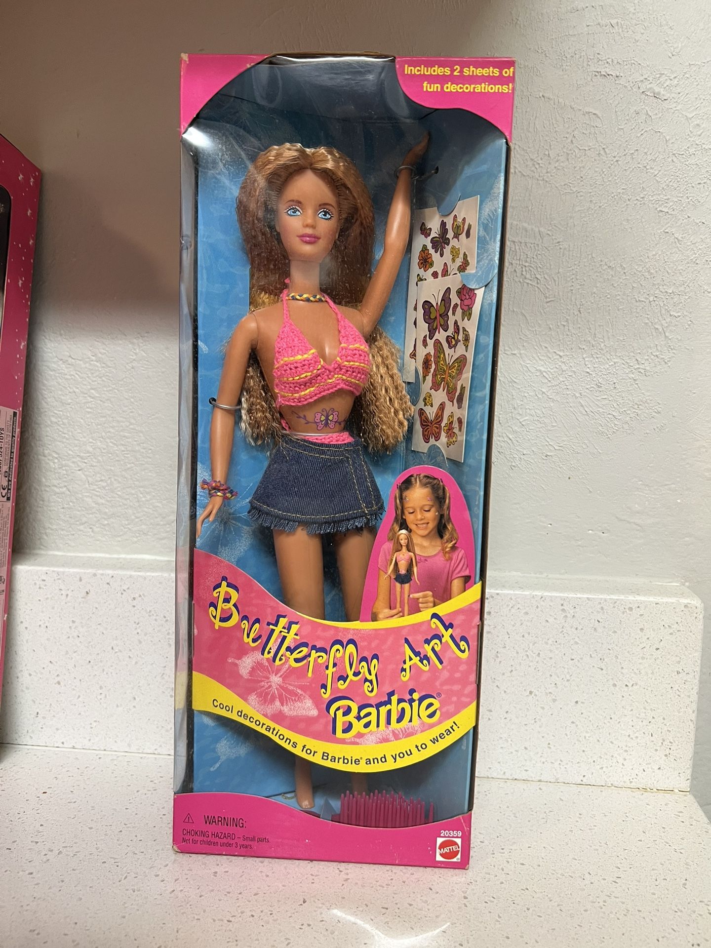 1998 Butterfly Art Barbie doll, Mattel. Includes two sheets of temporary tattoos for both the doll and the owner. The doll wears a pink and yellow kn