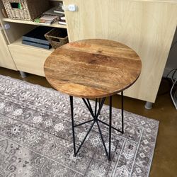 Medium dark stain wood end table with black metal legs