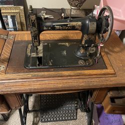 Antique white sewing machine