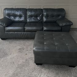 Ashley Furniture Faux Leather Sofa & ottoman 