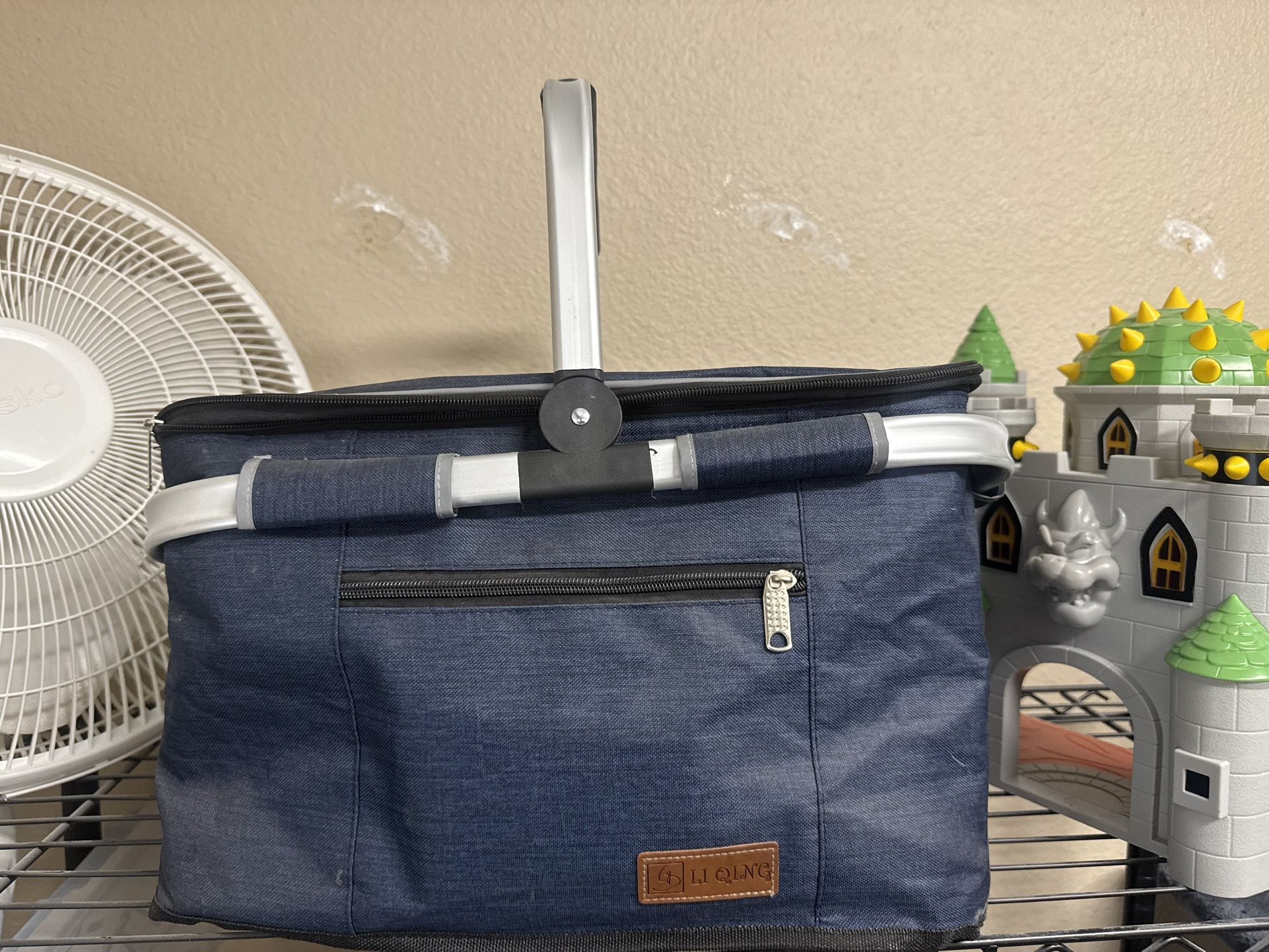 Insulated ice chest with a handle