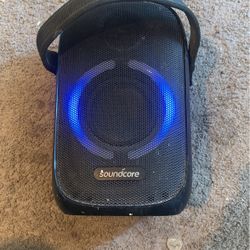 Big Soundcore speaker, waterproof but does have paint drops from when I used it while working.