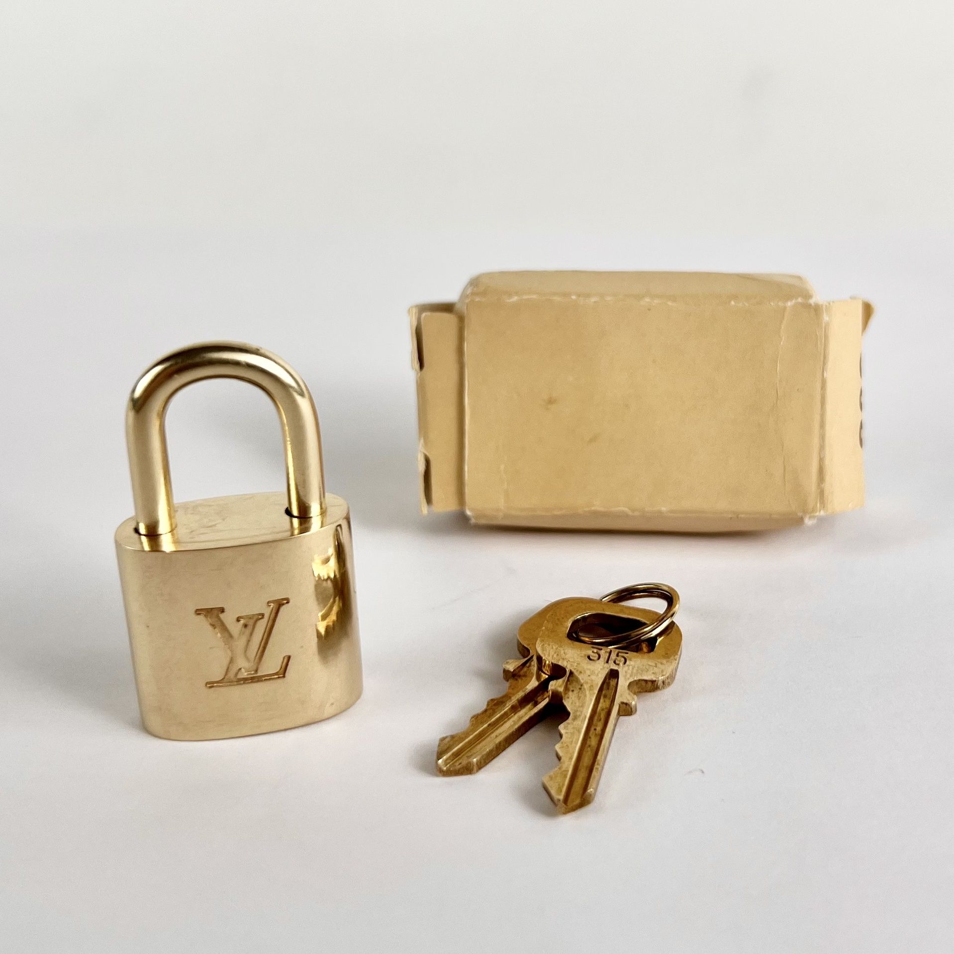 Authentic Brass Louis Vuitton Lock & Key Set