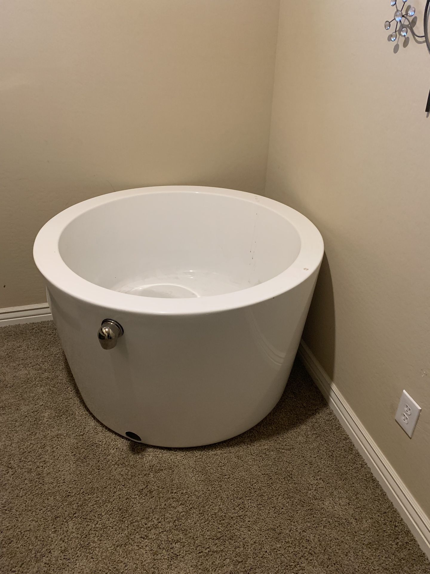 41” siglo round Japanese soaking tub . This acrylic tub is perfect for smaller bathroom areas. You can find it on the website signature {url removed}