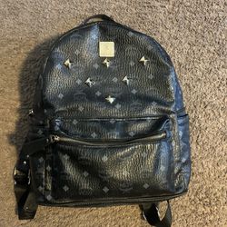 black and blue MCM backpack 