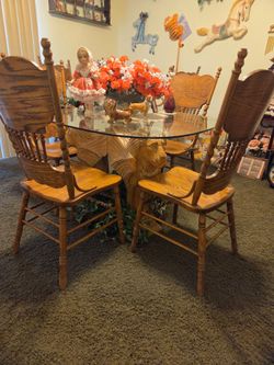Lion table carved out of one piece of wood, 3 lion heads,  one of a kind, perfect, very heavy, 4 chairs at match it. And the glass top is very thick.H