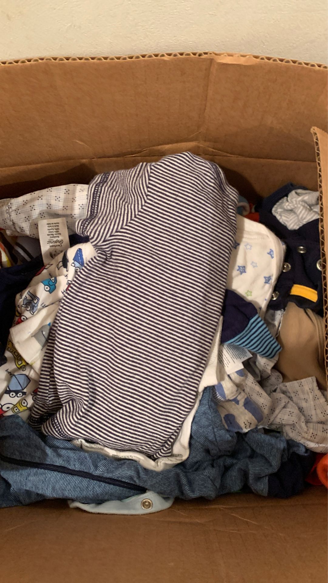 Box full of baby boy clothes mixed sizes