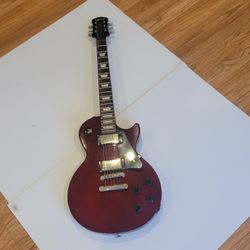 Epiphone Les Paul Studio Electric Guitar Wine Red. Pre-owned, very good 
working and cosmetic shape, please see photos for details. Guitar was 
checke