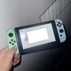 NINTENDO SWITCH ANIMAL CROSSING EDITION