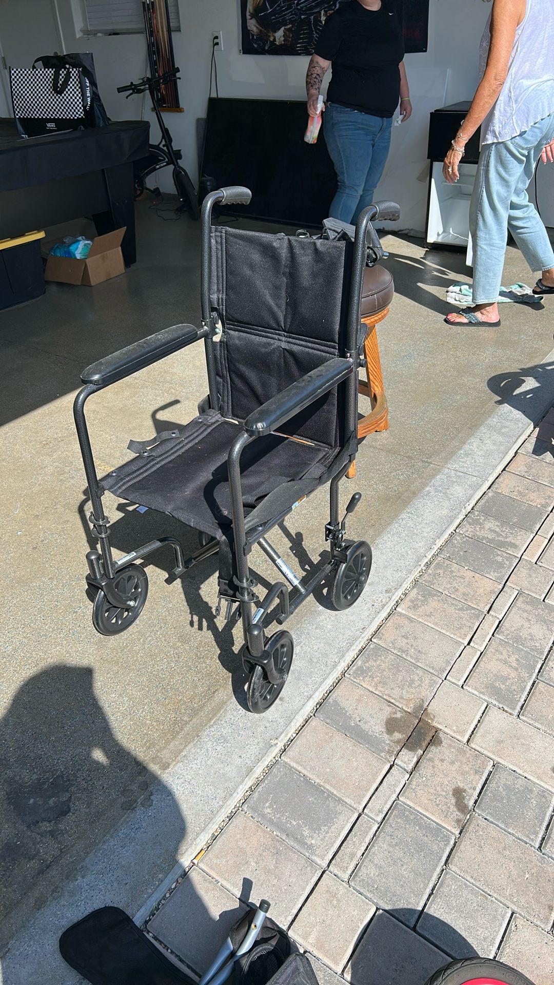 Compact Wheel Chair With Adjustable Foot Paddles