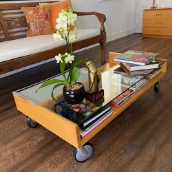 For sale italian coffee table—crafted from cherry wood, glass, metal tray and  wheels