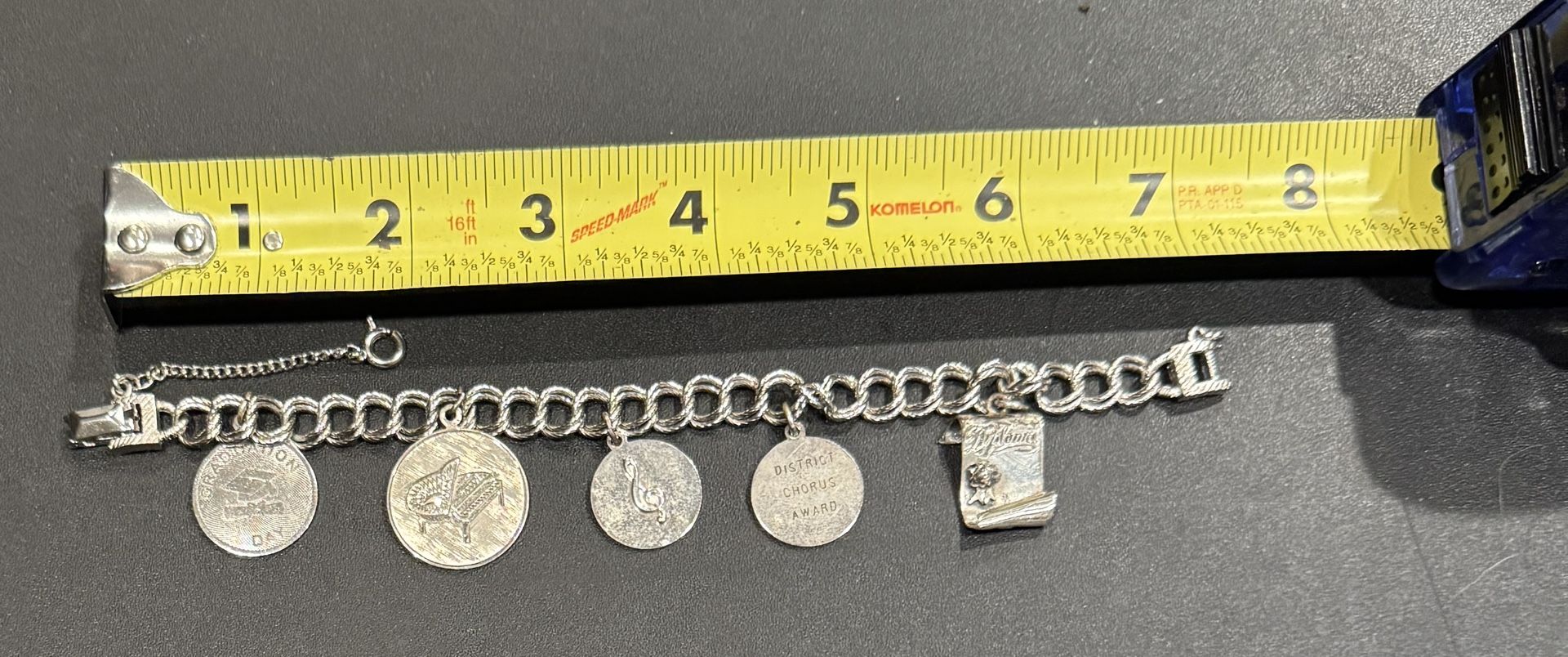 Choir/Piano/Graduation Bracelet. Vintage 1962. Charms show wear as shown. Personalized. One charm marked Sterling.