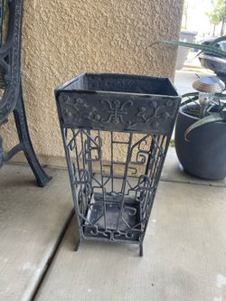 Ornate metal plant holder