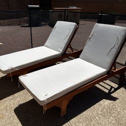 Two Wooden Lounge Chairs With Cushions