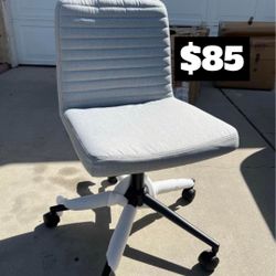 Brand New. Grey Armless Task Chair. Adjustable Height/Swivel.  $85