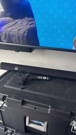 Black Soundbar with Remote and Power Adapter