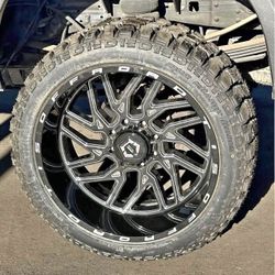TIS 544BM 24x12 Rims 33" R/T Tires Ford F150 Silverado Sierra Ram 1500 Finance Available