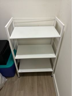 Pair metal shelf units