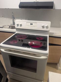 2 STOVES GLASS TOP $135 EACH