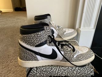 These are Nike Air Jordan 1 Retro High OG "White Cement" sneakers, featuring a prominent elephant print overlay.Model: Nike Air Jordan 1 Retro High OG