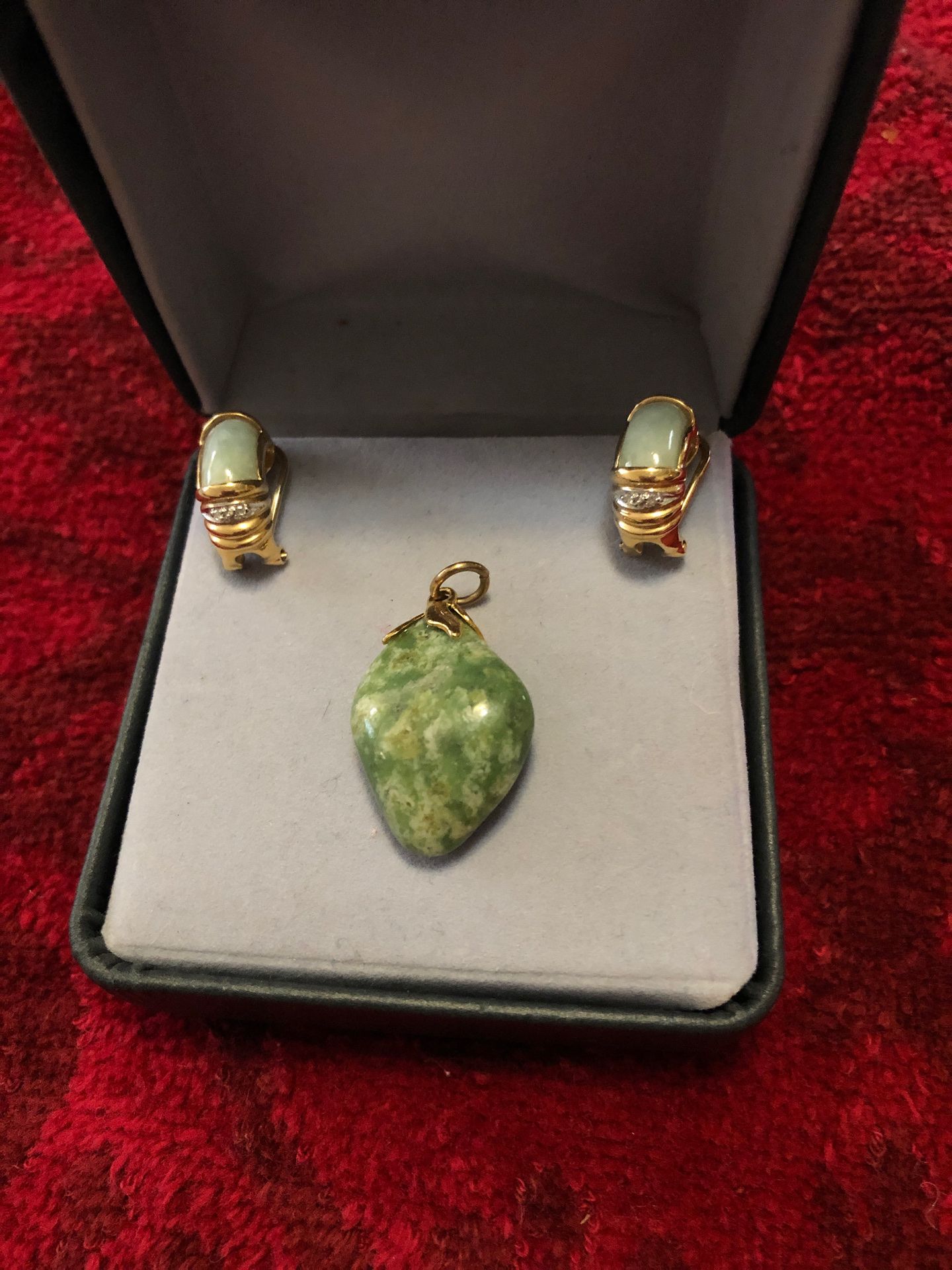 Jade and diamond clip earrings and jade pandents.
