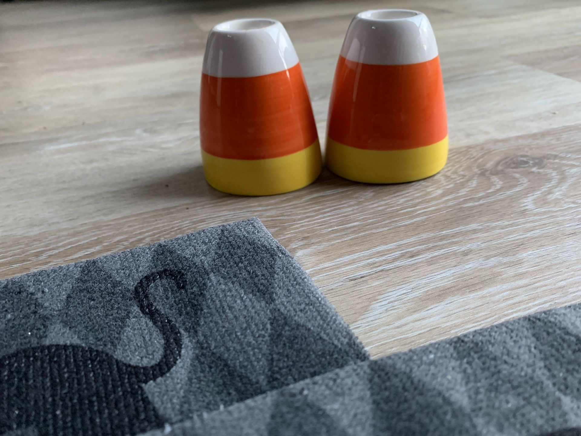 Adorable candies corn candle holders! With two unused display towels!