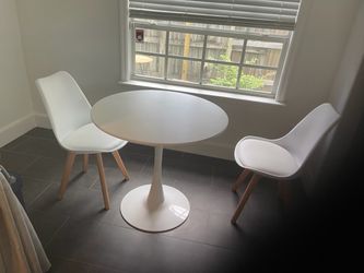 Round table with two chairs