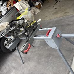 RYOBI 7-1/4-inch Sliding Miter Saw with Folding Stand And Rolling Wheels. Used On One Project Lots Of Life Left.