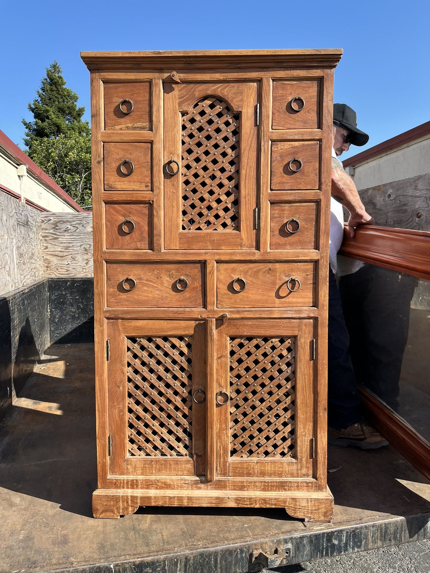 Spanish Wooden Covered With Shelves And Lattice Doors