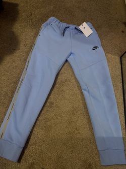 Light blue Nike tech pants
