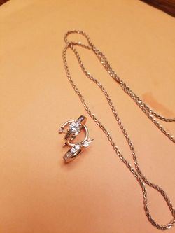 30" Silver chain, 1 silver Ring, 1 Silver earing, 10K earing Gold with Diamonds.