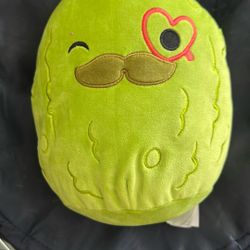Squishmallows Charles the Pickle plush toy. 