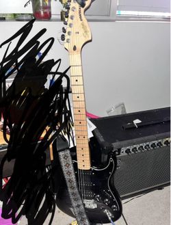 Squier Stratocaster HSS and Roland JC40 amp