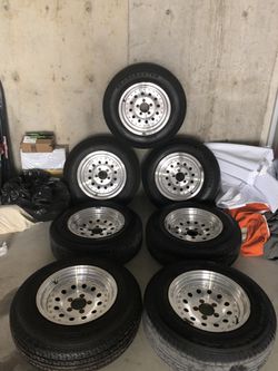 Trailer wheels with tires.