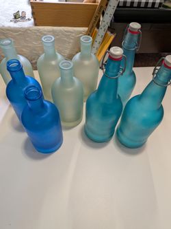 Lot of 9 glass bottles- blue and clear frosted home decor