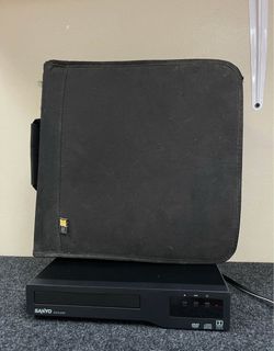 SANYO Player and Binder of DVDs. Over 150 DVDs! SANYO player turns on as ejects but hasn’t been fully tested.