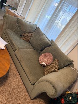 Matching sofa set. Mint green in color