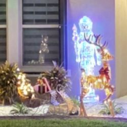 Reindeer And Sleigh With Christmas Tree And Gifts On Sleigh. 