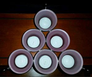 Brand new frosted pink tealight holder with 6 votive candle holders. I have 3 available. $10.00 each