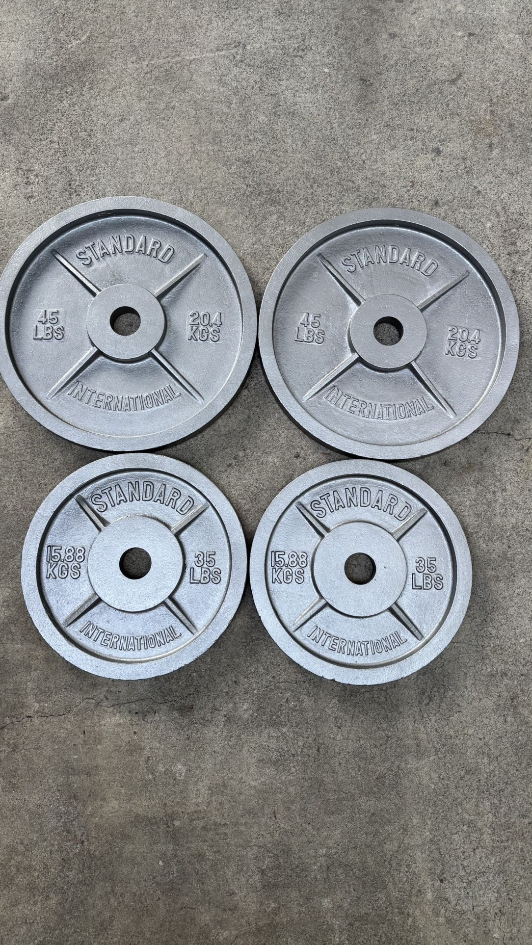 Pairs Of 35 And 45 Pound Olympic Standard International Weights